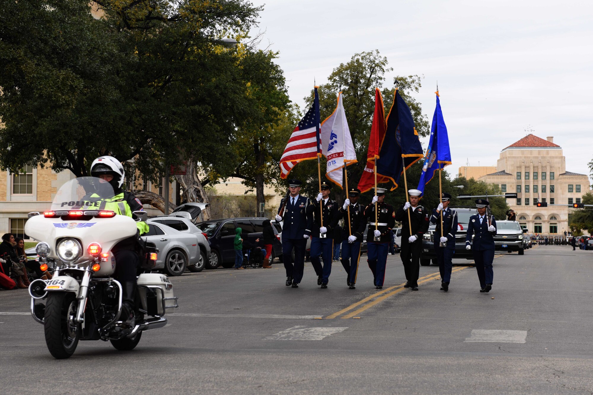 Joint Base Color Guard marches in the Veterans Day Parade in San Angelo, Texas, Nov. 10, 2018. The Color Guard led the parade through the streets of downtown San Angelo. (U.S. Air Force photo by Senior Airman Randall Moose/Released)