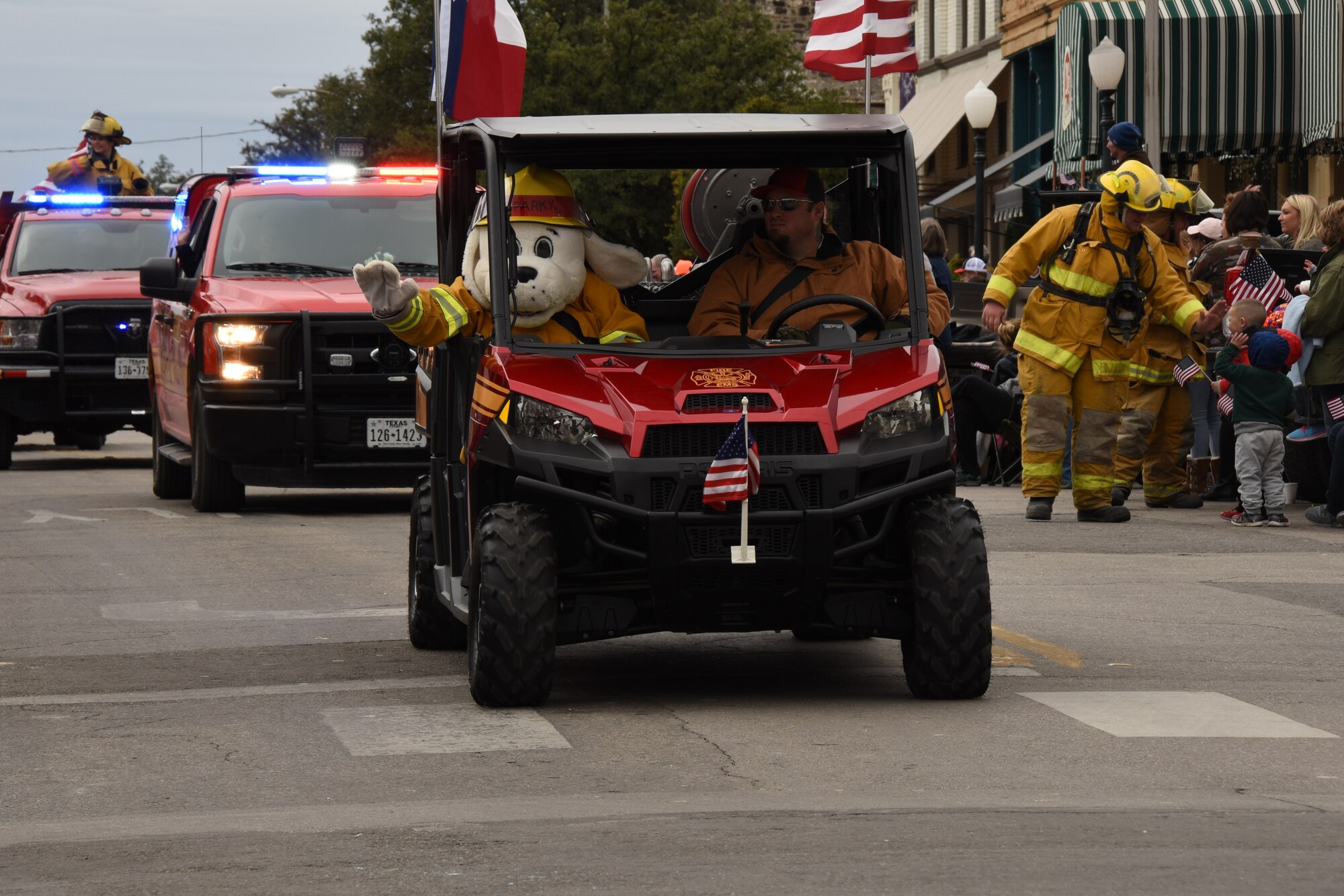 Sparky the Firedog joins the Grape Creek Volunteer Fire Department during the Veterans Day Parade in San Angelo, Texas, Nov. 10, 2018. San Angelo hosted the parade in honor of those serving and those who have served the country. (U.S. Air Force photo by Airman 1st Class Zachary Chapman/Released)