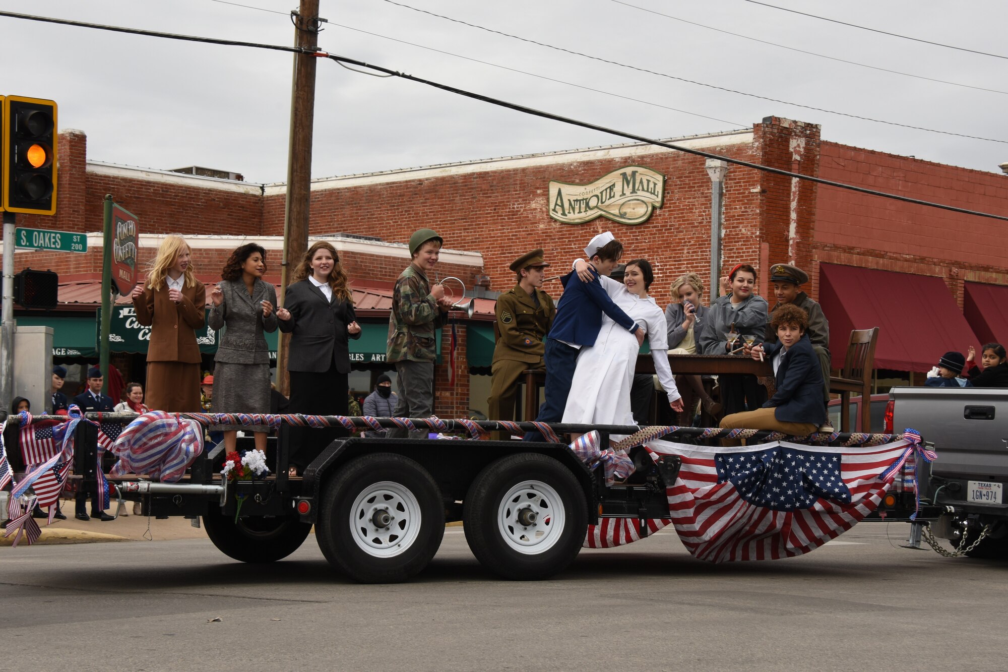 Ambleside School of San Angelo students pay tribute to all veterans with a flashback to the ‘40s during the Veterans Day Parade in San Angelo, Texas, Nov. 10, 2018. The students dressed as famous figures including Marilyn Monroe, the Andrew Sisters, a Tuskegee Airman, Rosie the Riveter and the V-J Day kiss. (U.S. Air Force photo by Airman 1st Class Zachary Chapman/Released)