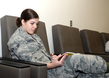 Airman 1st Class Brooke Martinez, a mental health technician at Wilford Hall Ambulatory Surgical Center on Joint Base San Antonio-Lackland, Texas, reads over some new material during the Nov. 8 Centering for Pregnancy session. The Centering program provides moms with information and resources designed to help them throughout every stage of their pregnancy. 
(U.S. Air Force photo by Daniel J. Calderón)