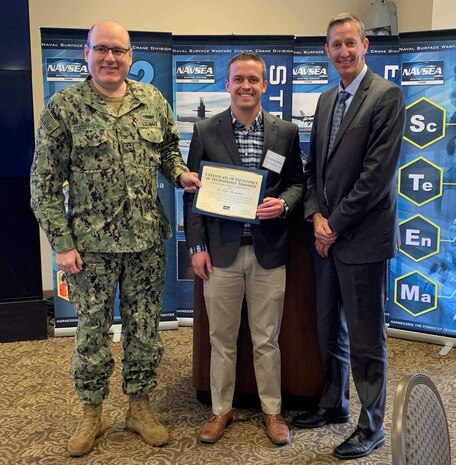 Dr. Kyle Crompton and Noah Roberts (not pictured) were named NSWC Crane Technology Transfer (T2) and Patent Contributors of the Year for their T2 program efforts. Dr. Crompton produced critical results by using tools available at the T2 office to partner with academia and industry. Roberts was recognized for using patents to make swift enhancements, modifications, and repairs to immediate problems in the field.