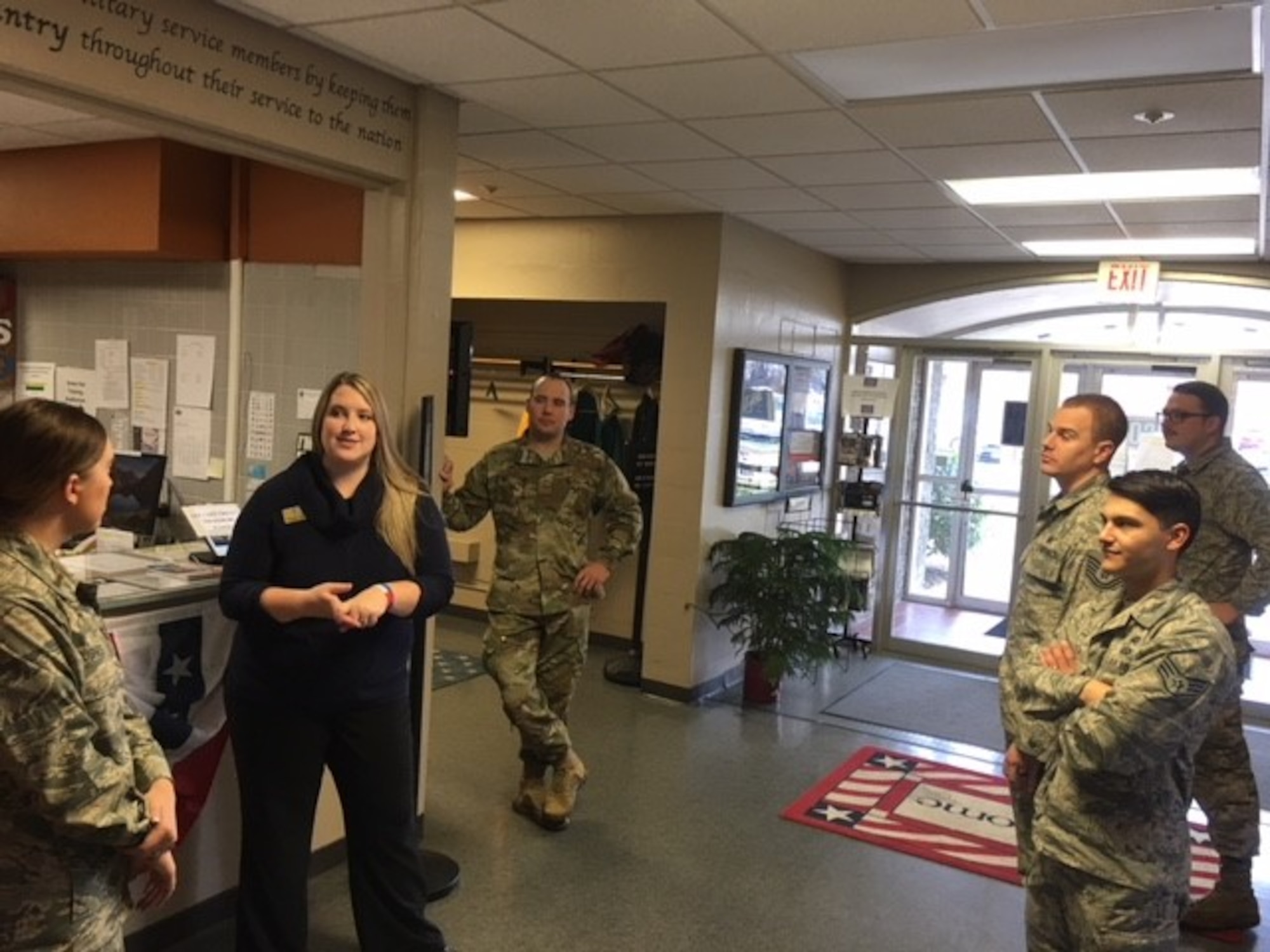 Whitney Armstrong, assistant manager at the Wright-Patterson AFB United Services Organization, greets and speaks with Airmen about upcoming holiday and other special events the USO will offer.