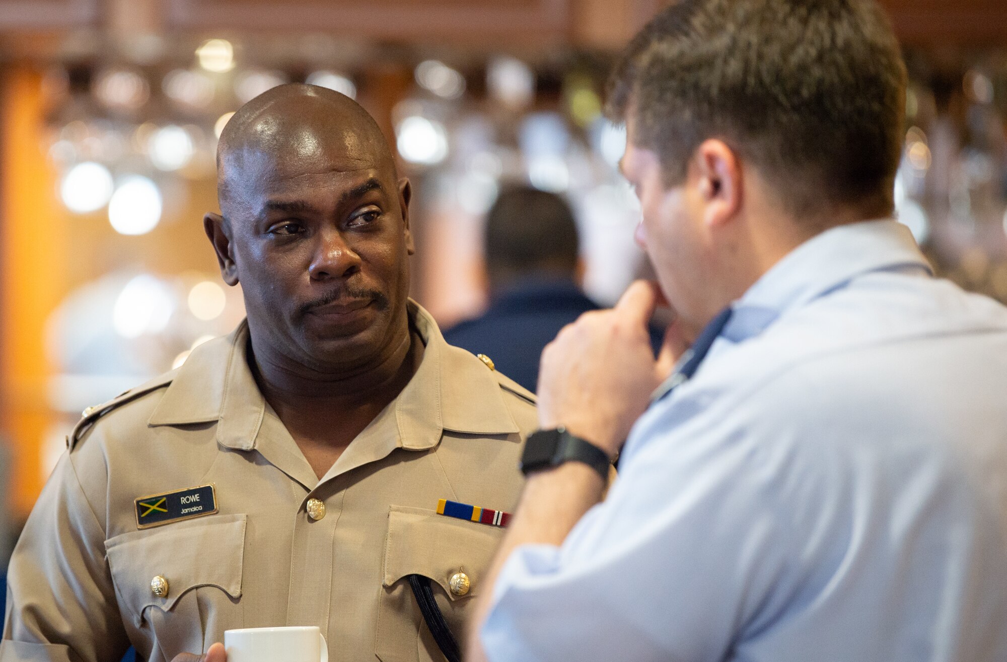 Lt. Col. Roderick Rowe, Jamaican Defense Force Air Wing commander, listens to a Chilean Air Force representative during the Central American and Caribbean Air Chief’s conference at Davis-Monthan Air Force Base, Ariz., Nov. 6-8, 2018.