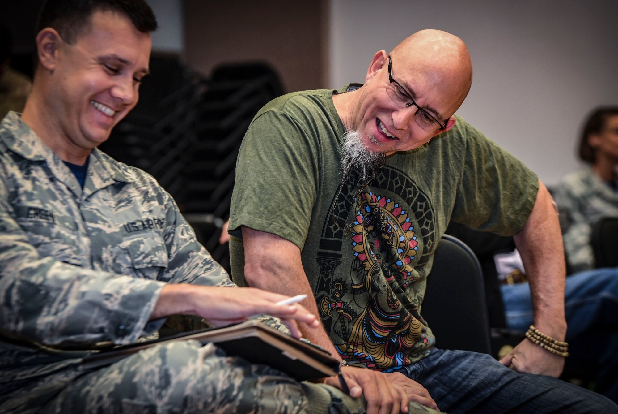 Grammy Award-winning saxophonist Jeff Coffin laughs with Senior Airman Bradley Greene, Rhythm in Blue music composer, during a visit to the Rhythm in Blue Jazz band at Joint Base Langley-Eustis, Va., Oct. 26, 2018. The Rhythm in Blue jazz band is one of seven ensembles from Air Combat Command’s Heritage of America Band. The band uses their music to tell the Air Force story throughout the Eastern United States, performing for diverse audiences from Maine to South Carolina. (U.S. Air Force photo by Tech. Sgt. Nick Wilson)