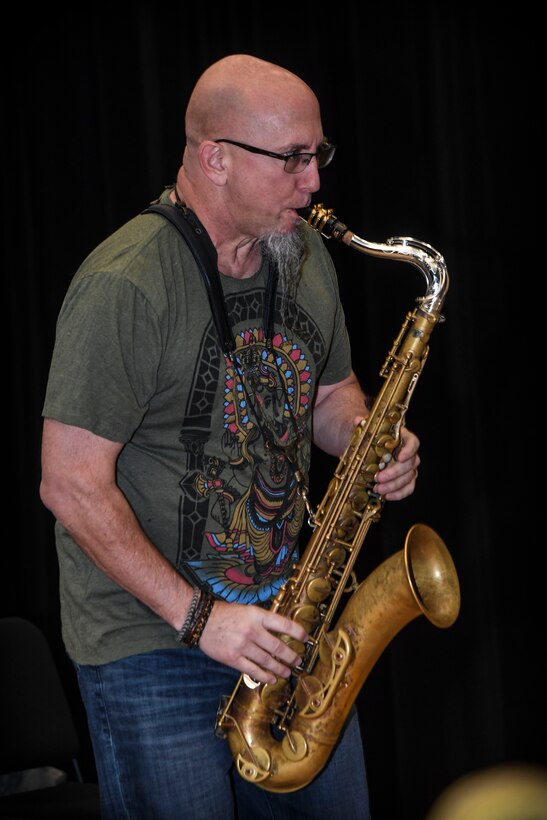 Grammy Award-winning musician Jeff Coffin plays the tenor saxophone during a training session at Joint Base Langley-Eustis, Virginia, Oct. 26, 2018. Coffin discussed his personal experiences and emphasized the impact music can make on the world when it is used as a tool to bridge cultural gaps. (U.S. Air Force photo by Tech. Sgt. Nick Wilson)