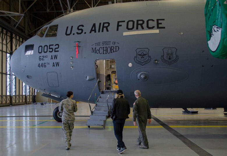 Iconic rock n’ roll musician Joe Walsh begins a tour of a C-17 Globemaster III with Col. Anthony Angelo, commander of the 446 AW Operations Group and Col. Kirsten Palmer, commander of the 446th Maintenance Group Nov. 7, 2018, on Joint Base Lewis-McChord, Wash. Walsh was in the area for a concert benefiting military veterans. (U.S. Air Force photo by Senior Master Sgt. Sherri Nordin)