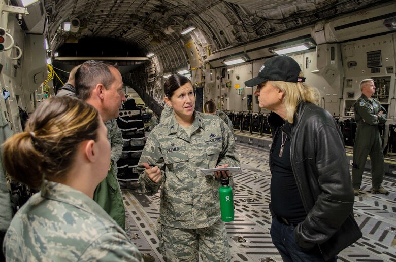 Col. Kirsten Palmer speaks to Joe Walsh aboard a C-17 Globemaster III Nov. 7, 2018, on Joint Base Lewis-McChord, Wash. Walsh was in the area for a concert benefiting military veterans. (U.S. Air Force photo by Senior Master Sgt. Sherri Nordin)