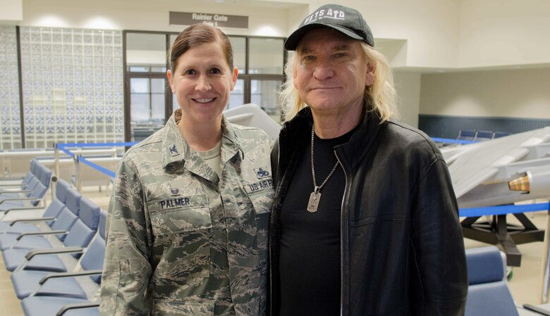 Commander of the 446th Maintenance Group Col. Kirsten Palmer poses for a photograph with iconic rock n’ roll musician Joe Walsh on Joint Base Lewis-McChord Nov. 7, 2018. (U.S. Air Force photo by Senior Master Sgt. Sherri Nordin)