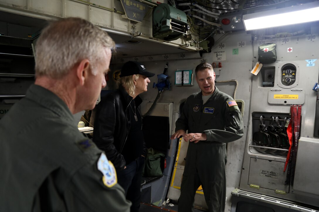 Col. Anthony Angelo, commander of the 446 AW Operations Group and Master Sgt. Brian Nichols, a loadmaster with the 728 Airlift Squadron, give a tour of the cargo area of a C-17 Globemaster III on Joint Base Lewis-McChord, Wash., Nov. 7, 2018. Walsh was in the area for a concert benefiting military veterans. (U.S. Air Force photo by David L. Yost)