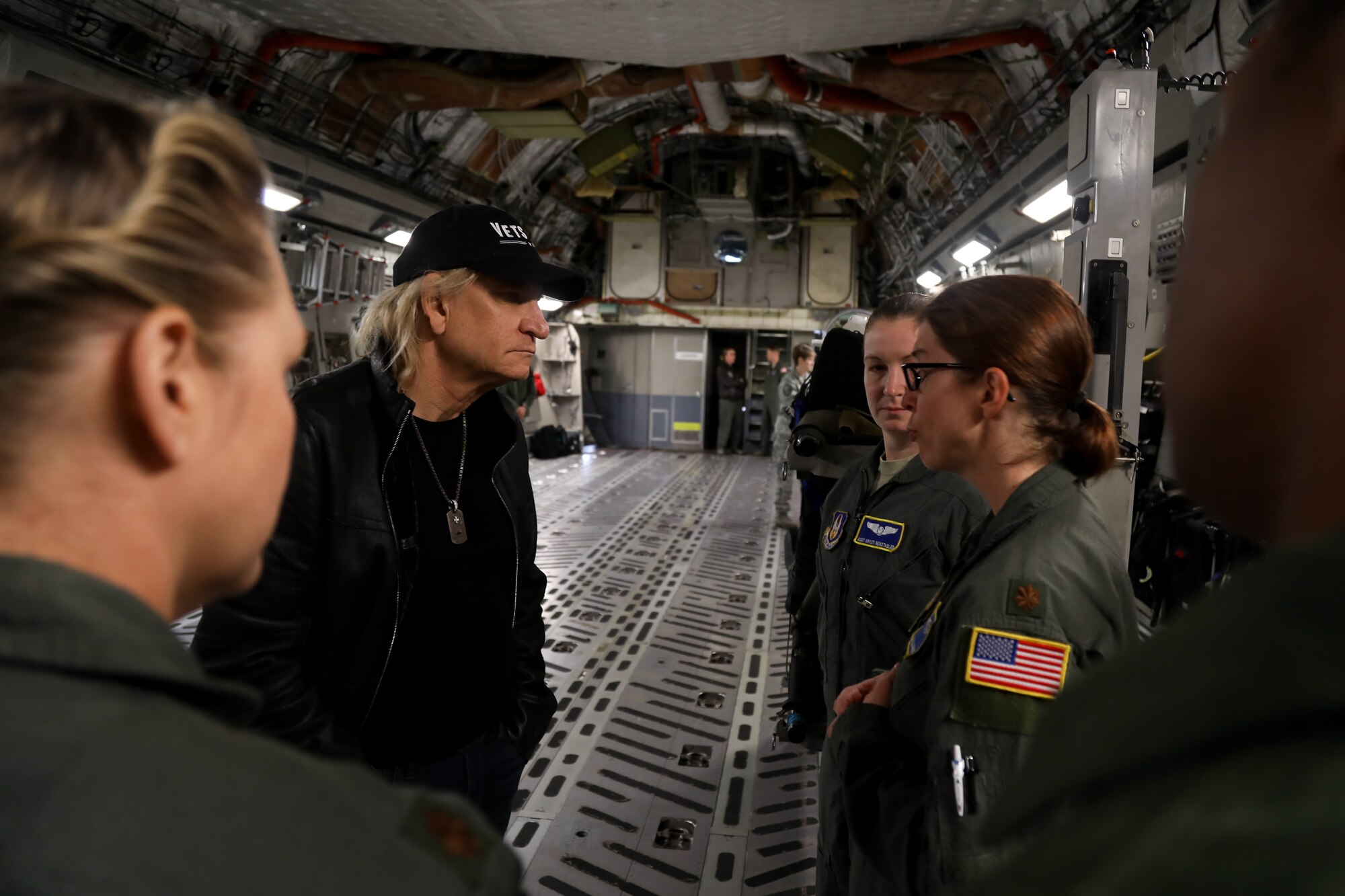 Members of the 446th Aeromedical Evacuation Squadron speak with Joe Walsh during a C-17 Globemaster III on Joint Base Lewis-McChord, Wash., Nov. 7, 2018. Walsh was in the area for a concert benefiting military veterans. (U.S. Air Force photo by David L. Yost)