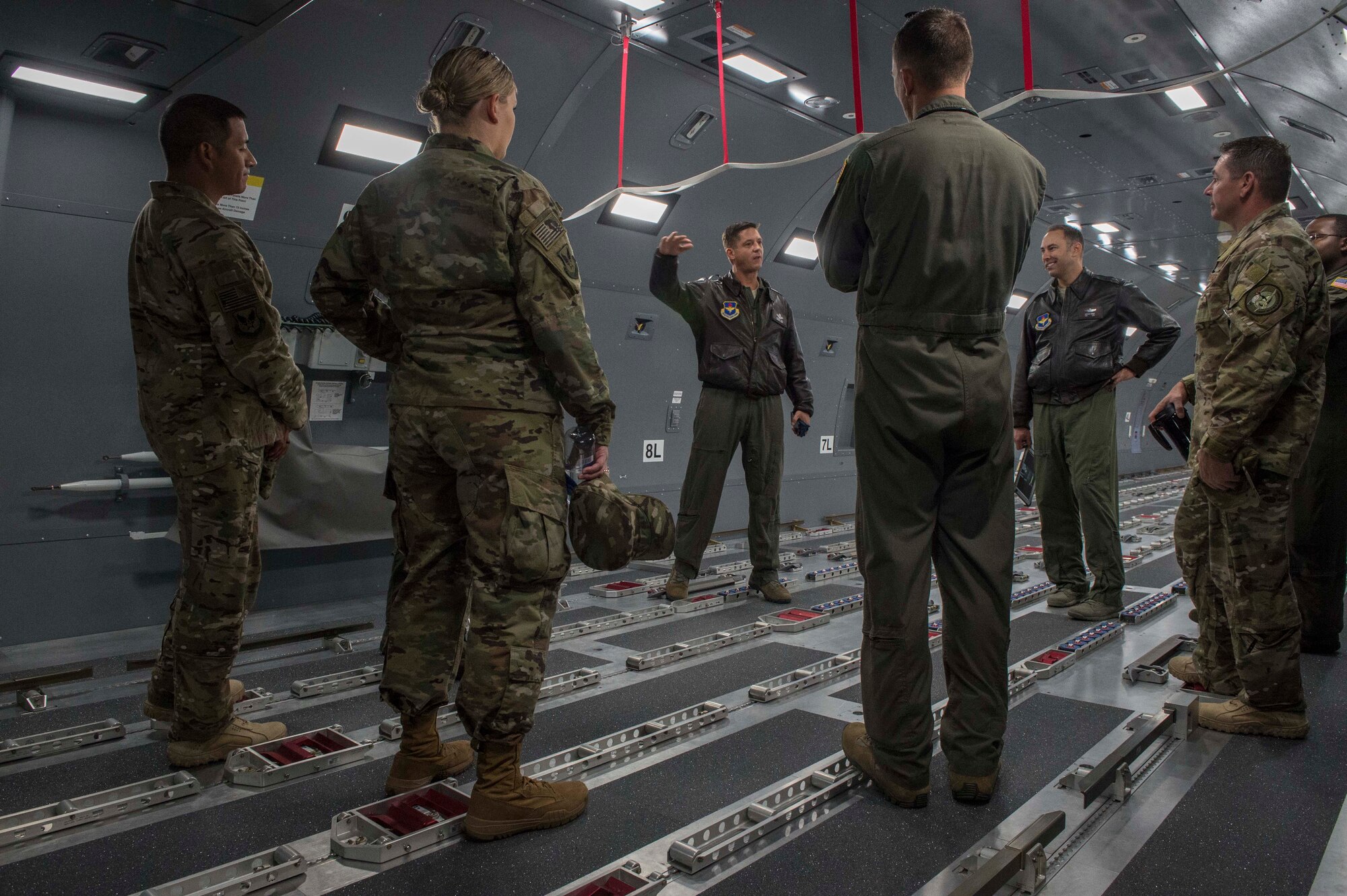 U.S. Air Force Chief Mast Sgt. Jason Hall, 97th Operations Group superintendent, showcases the KC-46 Pegasus Fuselage Trainer to the Air Force Personnel Center Career Enlisted Aviators assignment branch,