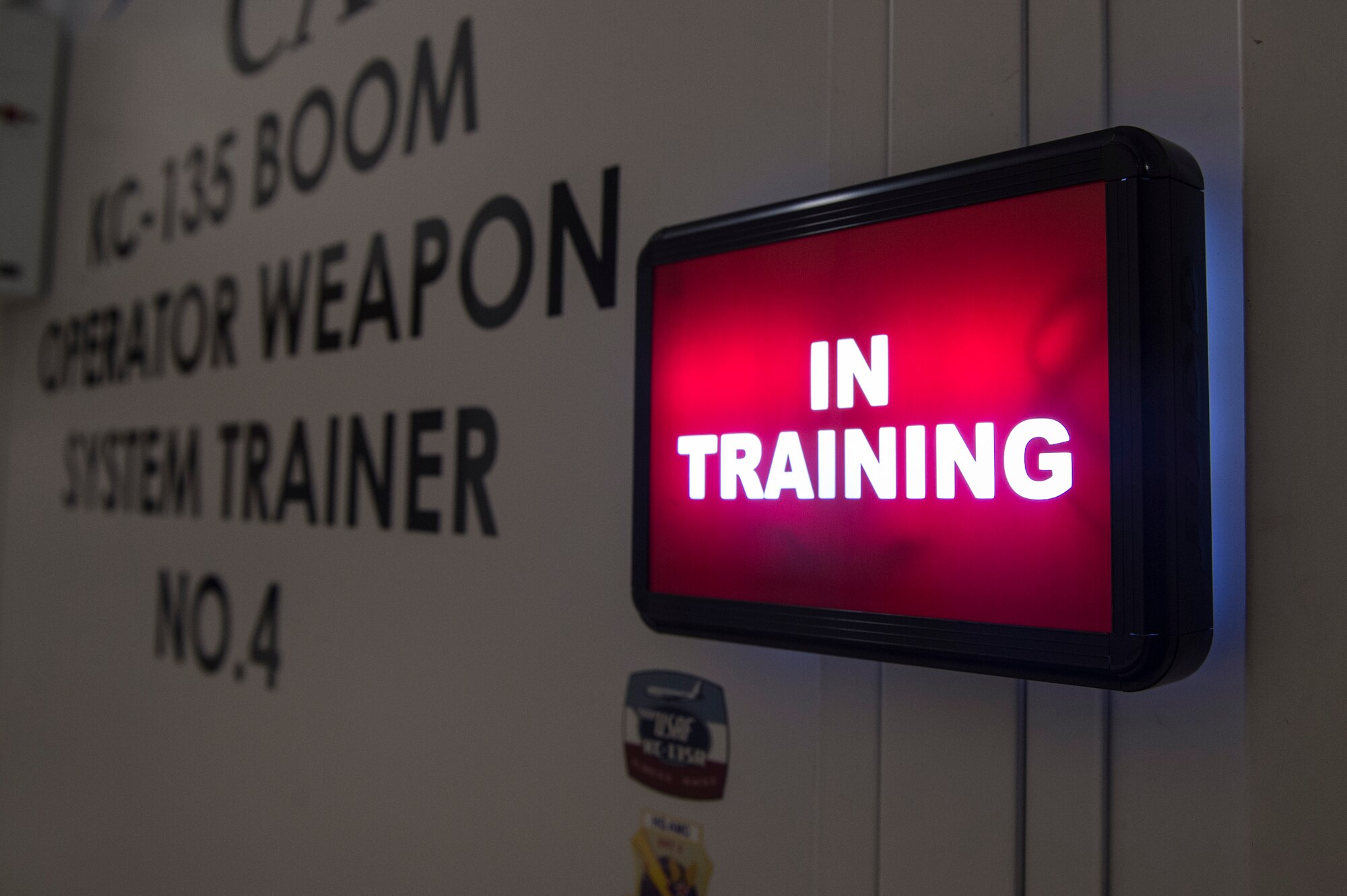 The light for the KC-135 Boom Operator Weapon System Trainer is on, indicating to others it is in use, Nov. 7, 2018, at Altus Air Force Base, Okla.