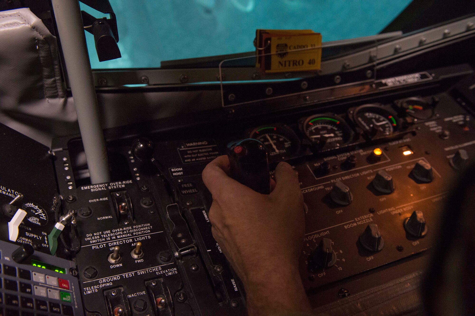 U.S. Air Force Chief Master Sgt. Randy Scanlan, Air Force Personnel Center Career Enlisted Aviators assignment branch chief, operates a KC-135 Boom Operator Weapon System Trainer