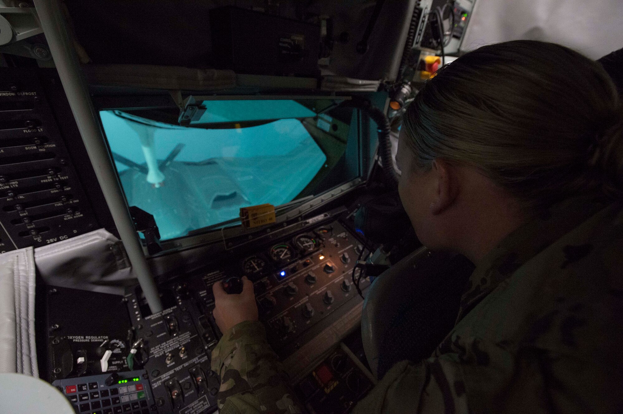U.S. Air Force Tech. Sgt. Kristie Collins, the pipeline training manager for the Air Force Personnel Center Career Enlisted Aviators assignment branch, uses a KC-135 Boom Operator Weapon System Trainer,