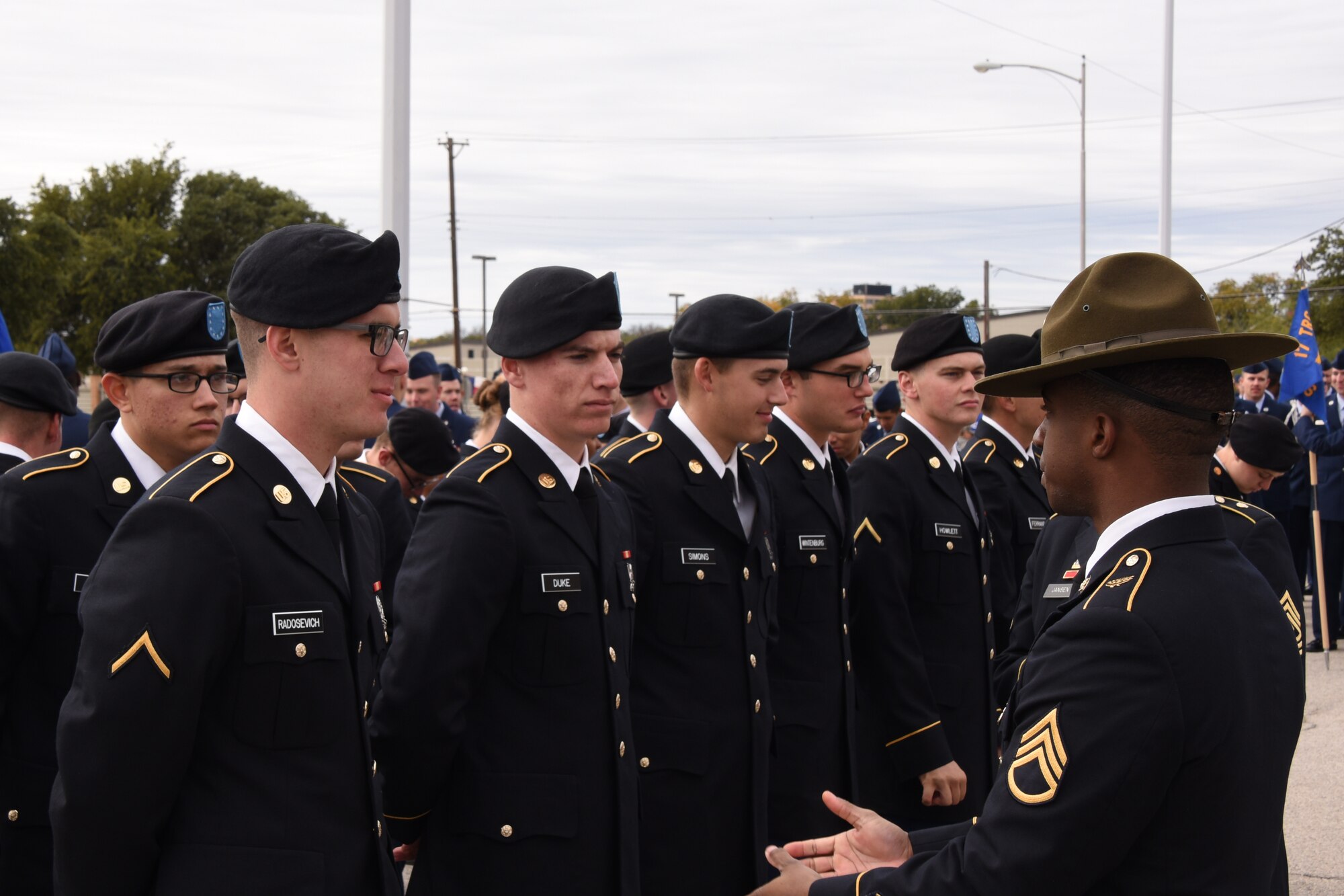 U.S. Army Staff Sgt. Brandon Lee, 344th Military Intelligence Battalion instructor, speaks to students before the Veterans Day Parade in San Angelo, Texas, Nov. 10, 2018. Members of the 344th MI BN joined the other organizations of Goodfellow to march and show support for those who have served and still serve. (U.S. Air Force photo by Airman 1st Class Zachary Chapman/Released)