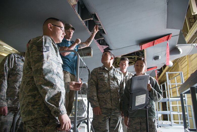 Staff Sgt. Caleb Gobbles, a 302nd Maintenance Squadron aircraft structures technician, demonstrates the use of a borescope to cadets from the U.S. Air Force Academy, Colorado, to detect metal corrosion beneath the tail of a C-130 Hercules aircraft Oct. 23, 2018, at Peterson Air Force Base, Colorado.