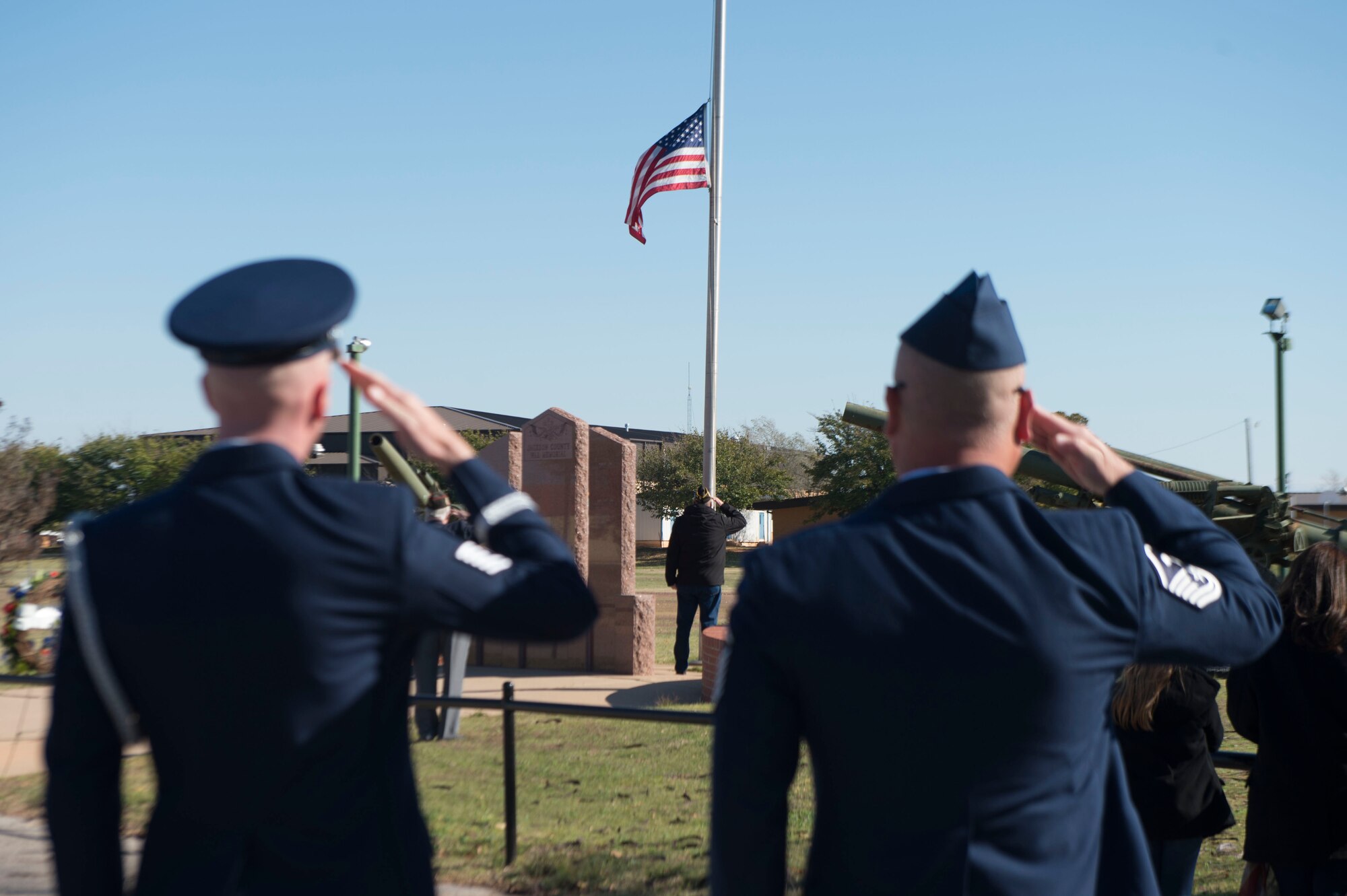 two men saluting