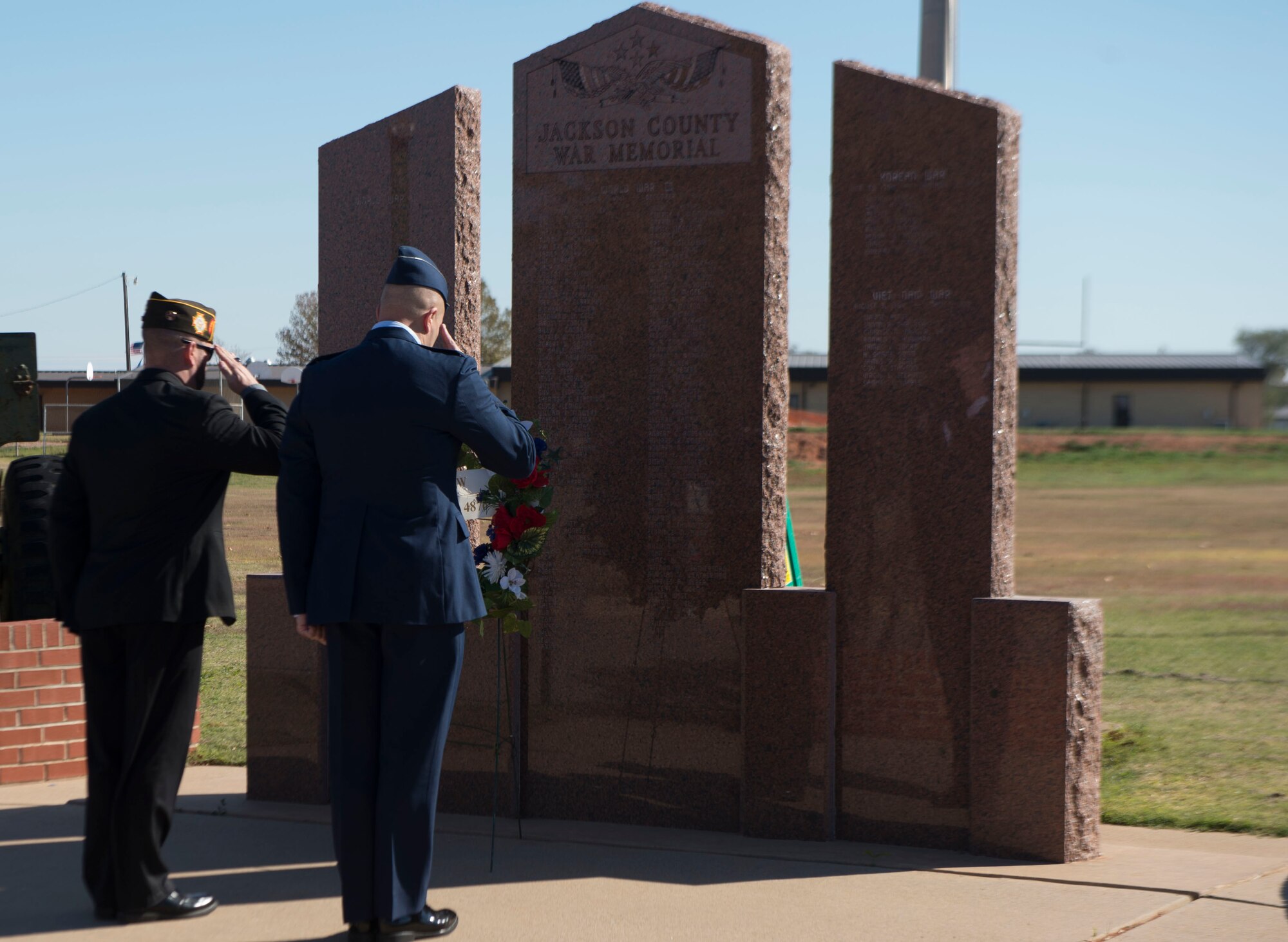 two men saluting