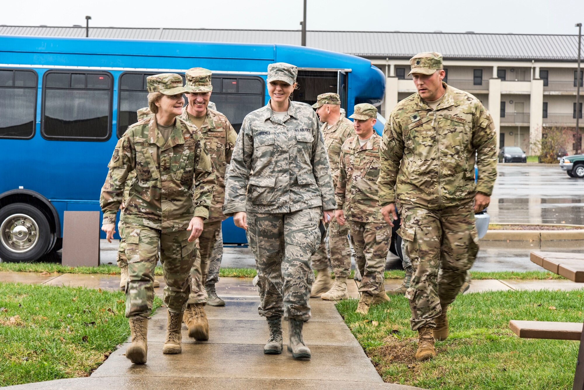 Left to right, Gen. Maryanne Miller, Air Mobility Command commander; Master Sgt. Amber Lawrence, 436th Civil Engineer Squadron unaccompanied housing supervisor; and Lt. Col. Travis Guidt, 436th CES commander, walk up to dormitory 401 for a briefing on its history Nov. 6, 2018, at Dover Air Force Base, Del. Lawrence briefed Miller that this particular dorm was built in 1976 and received a minor renovation in 2004. (U.S. Air Force photo by Roland Balik)