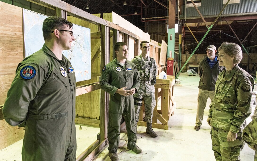 Gen. Maryanne Miller, right, Air Mobility Command commander, speaks with 436th Security Force Squadron Ravens, Staff Sgt. Tyler Smith, Senior Airman Nicholas Christopher, and Staff Sgt. Kirk Salvage, left to center respectively, Nov. 6, 2018, at Dover Air Force Base, Del. The three briefed Miller about the construction and use of the shoot house in an unused building. The shoot house on base eliminates the need to schedule training times at local off-base facilities. (U.S. Air Force photo by Roland Balik)