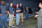 Lt. Col. Brandi B. King, 356th Airlift Squadron instructor pilot, describes C-5M Super Galaxy capabilities to a group of Texas A&M Reserve Officer Training Corps students and instructors at Joint Base San Antonio-Lackland, Texas Nov. 6, 2018.