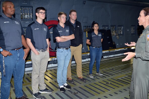 Lt. Col. Brandi B. King, 356th Airlift Squadron instructor pilot, describes C-5M Super Galaxy capabilities to a group of Texas A&M Reserve Officer Training Corps students and instructors at Joint Base San Antonio-Lackland, Texas Nov. 6, 2018.