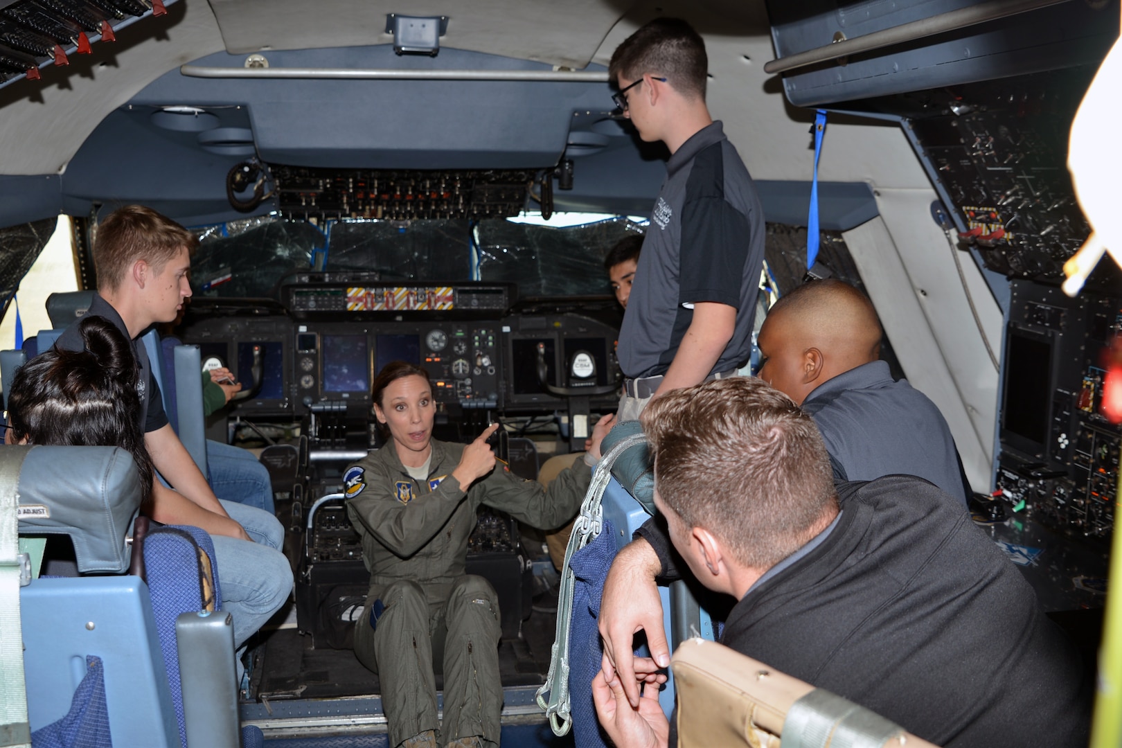 Lt. Col. Brandi B. King, 356th Airlift Squadron instructor pilot with the 433rd Airlift Wing, describes C-5M Super Galaxy flight deck functions to a group of Texas A&M University Reserve Officer Training Corps students and instructors at Joint Base San Antonio-Lackland, Texas Nov. 6, 2018.