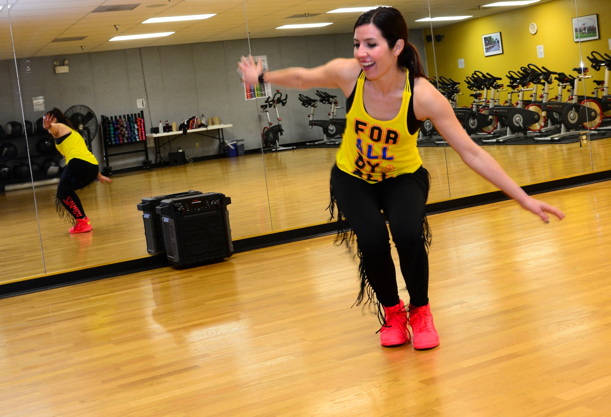 Gabriela Hallada demonstrates a Zumba routine at the Kirtland East Fitness Center Nov. 10. Hallada’s Zumba classes take place Wednesday’s at 5:30 p.m. and (Zumba Strong) Saturdays at 9 a.m. in the cardio room of the East Fitness Center. The classes are free to anyone with base access. (U.S. Air Force photo by Jessie Perkins)