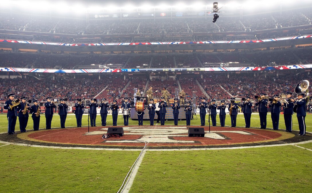 The U.S. Air Force Band of the Golden West from Travis Air Force Base, California, perform during halftime of the San Francisco Forty-Niners and New York Giants Monday Night Football game at Levi’s Stadium in Santa Clara, California, Nov. 12, 2018. The band performed in honor of Veterans Day and to support the National Football League’s Salute to Service Campaign. (U.S. Air Force photo by Louis Briscese)