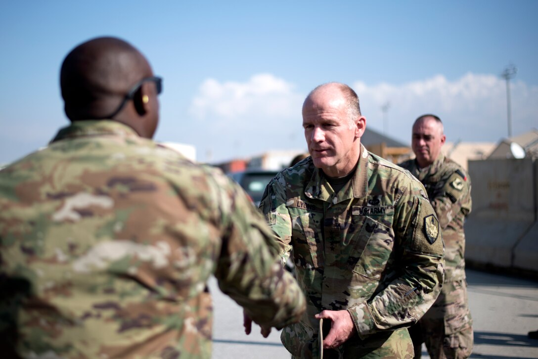 U.S. Army Gen. Stephen Lyons, commander of U.S. Transportation Command, shakes hand with an Airman at the Craig Joint Theater Hospital during a visit Nov. 11, 2018.