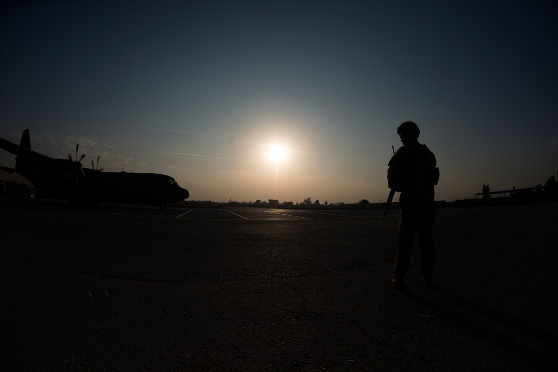 Airmen assigned to the 455th Expeditionary Security Forces Squadron provide fly away securty during a flight to Jalalabad Airfield, Afghanistan Nov. 10, 2018.