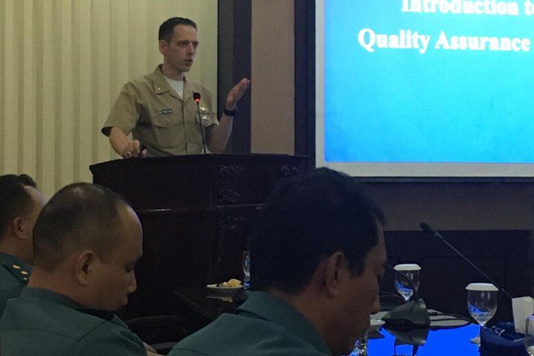 SURABAYA, Indonesia (Nov. 14, 2018) Cmdr. Randolph Reed, Submarine Group 7 Deputy Chief of Staff for Plans, Exercises & Engagement, gives a brief to members of the Indonesian Navy during U.S.-Indonesia staff talks in Surabaya, Indonesia. During the staff talks, headed by Rear Adm. Jimmy Pitts, Commander, Submarine Group 7,  personnel from both nations will exchange best practices on submarine force tactics and crisis response.