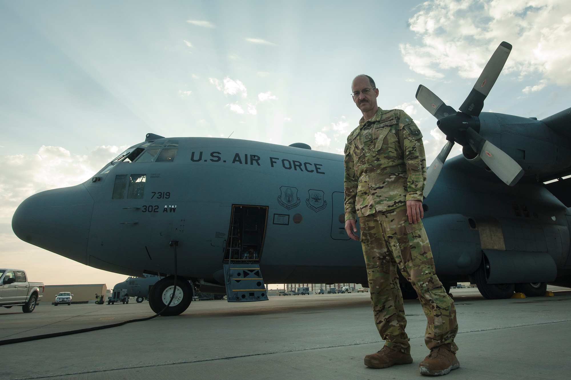 U.S. Air Force Reserve Chief Master Sgt. Kenneth Kunkel, 746th Expeditionary Airlift Squadron flight engineer, processes paperwork for a C-130 Hercules pre-flight inspection Nov. 13, 2018, at Al Udeid Air Base, Qatar. Kunkel reached 10,000 flying hours Oct. 6, 2018 a number considered prestigious amongst military aviators. (U.S. Air Force photo by Tech. Sgt. Christopher Hubenthal)