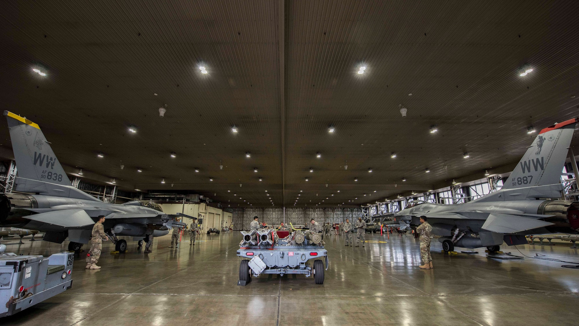 Team Misawa members with the 13th and 14th Aircraft Maintenance Units work on their respective aircrafts during the third quarter load competition at Misawa Air Base, Japan, Nov. 9, 2018. The competition participants received judgments on safety infractions, munition reliability, tool accountability and dress and appearance. (U.S. Air Force photo by Airman 1st Class Collette Brooks)