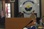 SURABAYA, Indonesia (Nov. 14, 2018) Rear Adm. Jimmy Pitts, Commander, Submarine Group 7, right, Rear. Adm. Muhammad Ali give opening remarks at the start of U.S.-Indonesia submarine force staff talks in Surabaya. Pitts and members of his staff will meet with several Indonesian Navy representatives in the coming days for staff talks, office calls and subject matter exchanges.