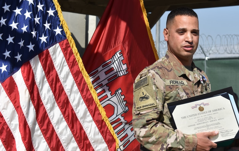 Staff Sgt. Vincent Fiorillo dons his Meritorious Service Medal and NATO medal as he ends a successful tour in Afghanistan supporting USACE in its rebuilding efforts in theater.