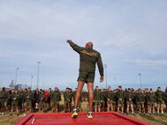 Sgt. Maj. Adam J. Moore, sergeant major of Headquarters and Service Battalion, U.S. Marine Corps Forces Command, leads Marines and Sailors during warm up exercises as part of the MARFORCOM 243rd Marine Corps birthday run Nov. 8, 2018, at Naval Station Norfolk, Norfolk, Virginia. The run was held in celebration of the 243rd Marine Corps birthday and to commemorate the 100 year anniversary of the end of World War I.  (U.S. Marine Corps photo by Sgt. Jessika Braden/Released)