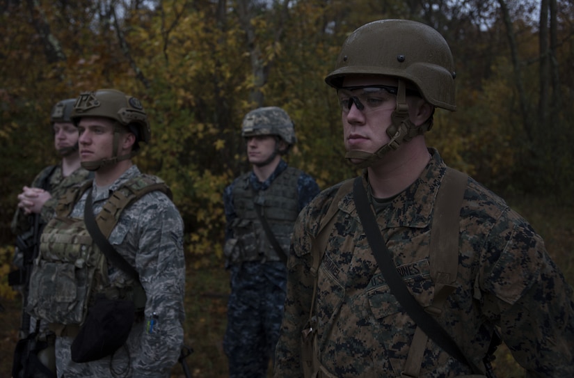 Service members listen to instructions during the 2018 Service Member of the Year Competition on Joint Base McGuire-Dix-Lakehurst, New Jersey, Nov. 5, 2018. Two members from each military service, excluding the Coast Guard, represented their respective service in the three day challenge. (U.S. Air Force photo by Airman 1st Class Ariel Owings)