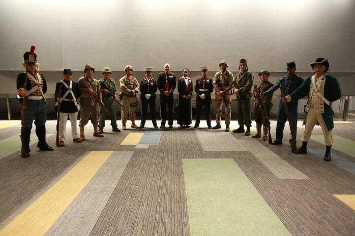 U.S. Marines with U.S. Marine Corps Forces Command participate in a uniform pageant during the 243rd Marine Corps birthday ball Nov. 3, 2018 at the Virginia Beach Convention Center, Virginia Beach, Virginia. Each year Marines commemorate the Marine Corps Birthday by reflecting on its rich traditions through the reading of General John A. Lejeune’s Birthday Message and the cutting of the birthday cake. (U.S. Marine Corps photo by Lance Cpl. Garett Burns/Released)