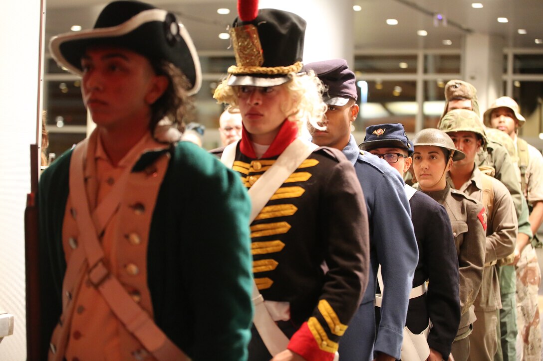 U.S. Marines with U.S. Marine Corps Forces Command participate in a uniform pageant during the 243rd Marine Corps birthday ball Nov. 3, 2018 at the Virginia Beach Convention Center, Virginia Beach, Virginia. Each year Marines commemorate the Marine Corps Birthday by reflecting on its rich traditions through the reading of General John A. Lejeune’s Birthday Message and the cutting of the birthday cake. (U.S. Marine Corps photo by Lance Cpl. Garett Burns/Released)