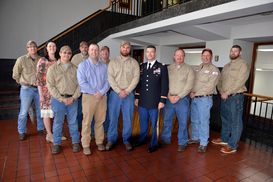 Lt. Col. Cullen Jones, Nashville District commander, (center)  congratulates Cade Barnes, maintenance worker, at Dale Hollow Power House for his selection as the Nashville District’s Employee of the Month for September 2018 as his co-workers stand with him at the Dale Hollow Power House.