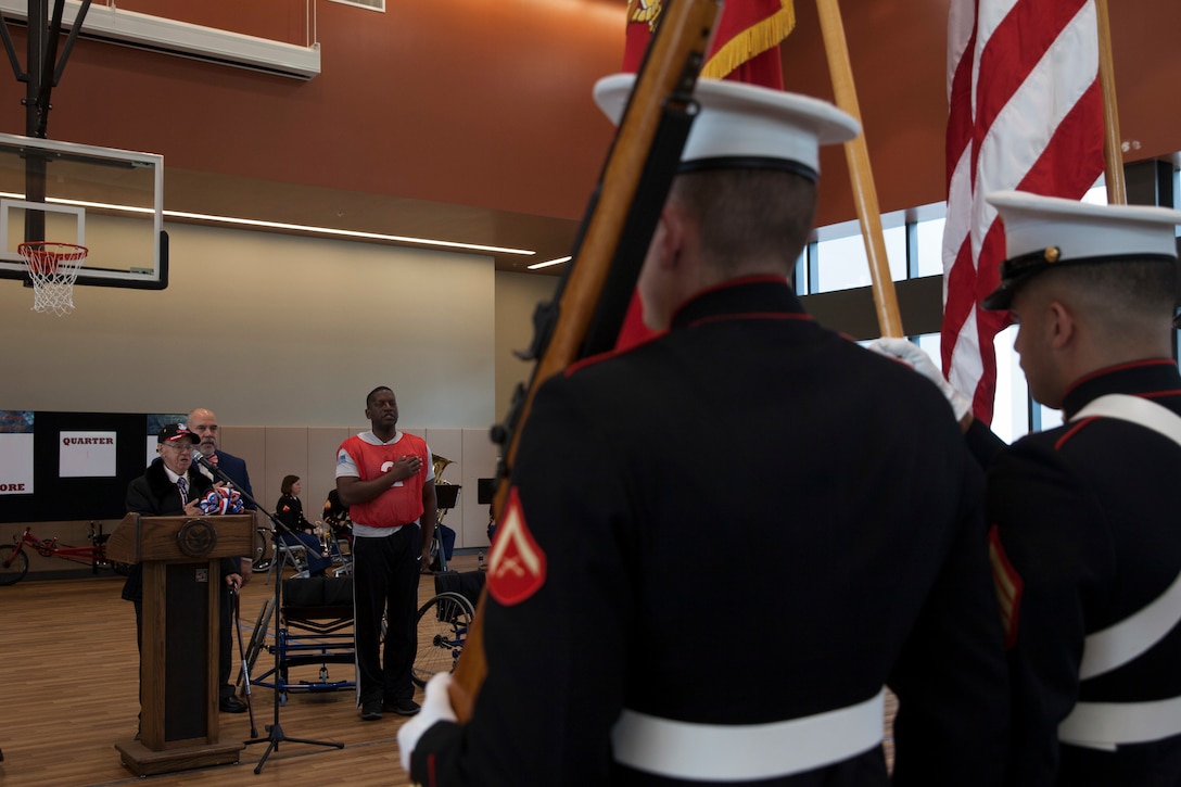 Marine Veteran Faust “Al” Navazio recites the Pledge of Allegiance before a wheelchair basketball game at the Southeast Veteran’s Hospital in New Orleans, Nov. 11, 2018.