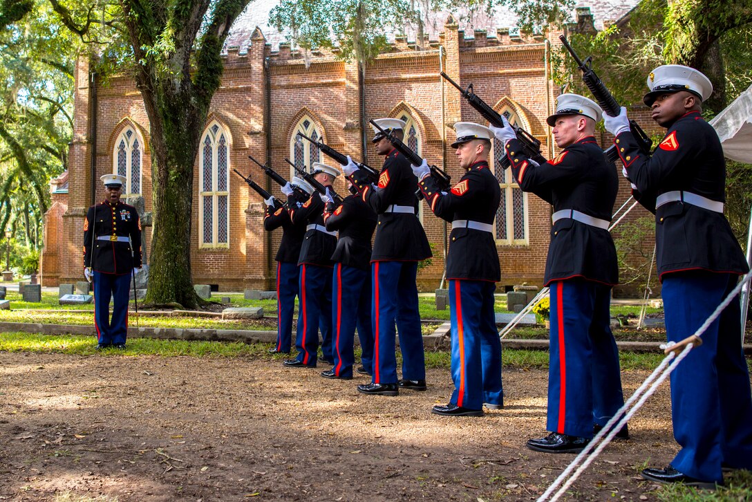 A rifle team of Marines from Truck Company, 23rd Marine Regiment, 4th Marine Division, perform a 21-gun salute at the gravesite of Gen. Robert H. Barrow, 27th Commandant of the Marine Corps.