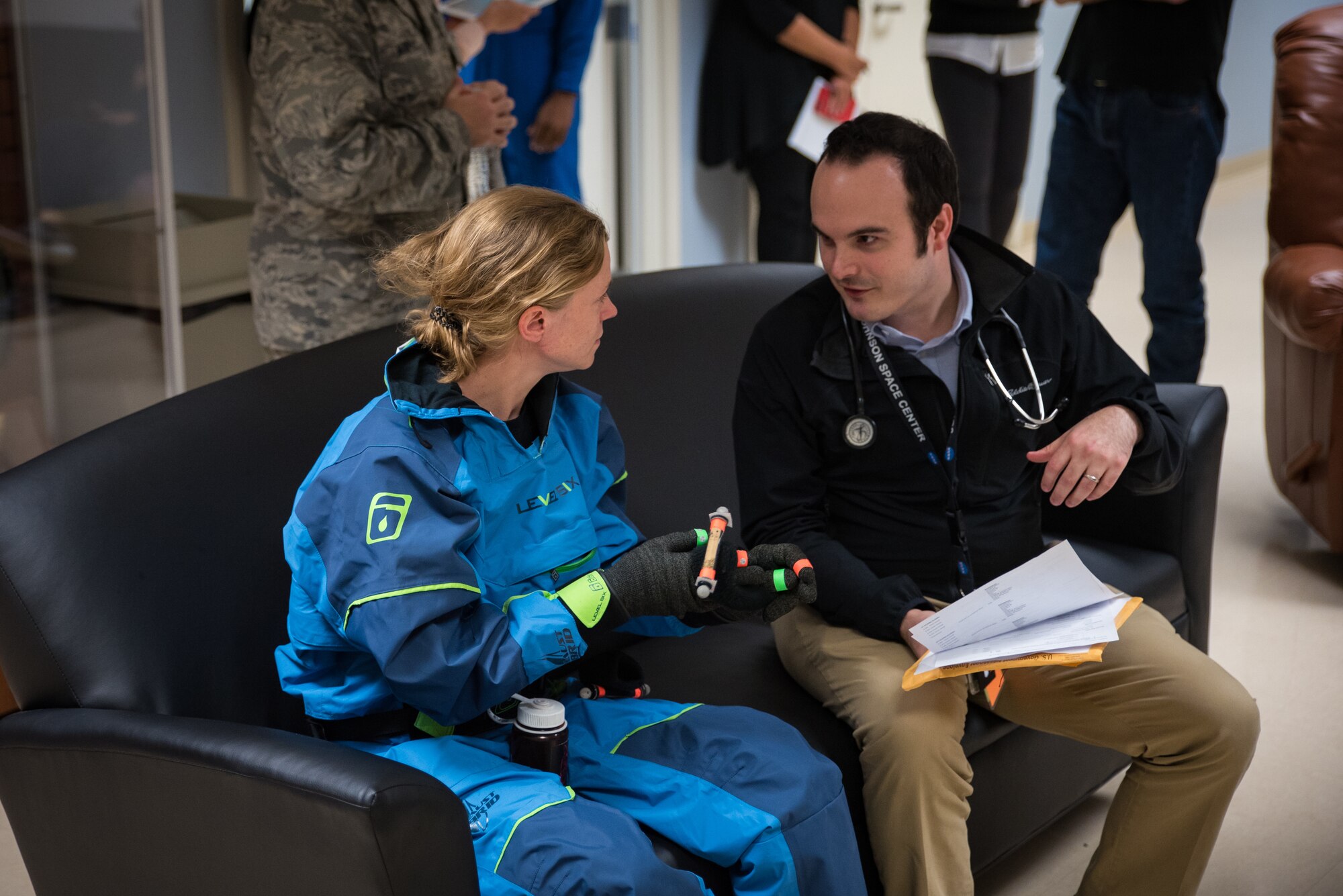 NASA astronaut candidate Zena Cardman speaks with a NASA physician following her spin in the centrifuge during testing in the Air Force Research Laboratory's 711th Human Performance Wing Nov. 1 and 2.