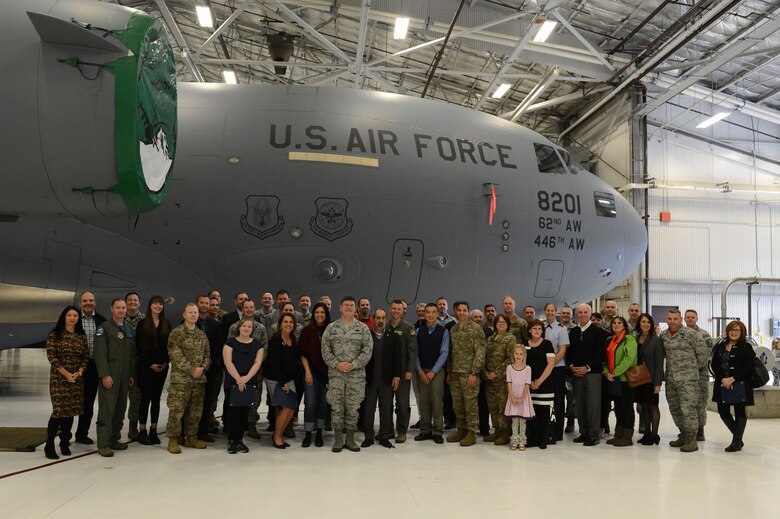 Newly inducted honorary commanders, alumni, unit commanders and family members attend the Team McChord Honorary Commander induction ceremony, Nov. 2, 2018, at Joint Base Lewis-McChord, Wash. Honorary commanders serve for two years before becoming alumni. (U.S. Air Force photo by Airman First Class Sara Hoerichs)