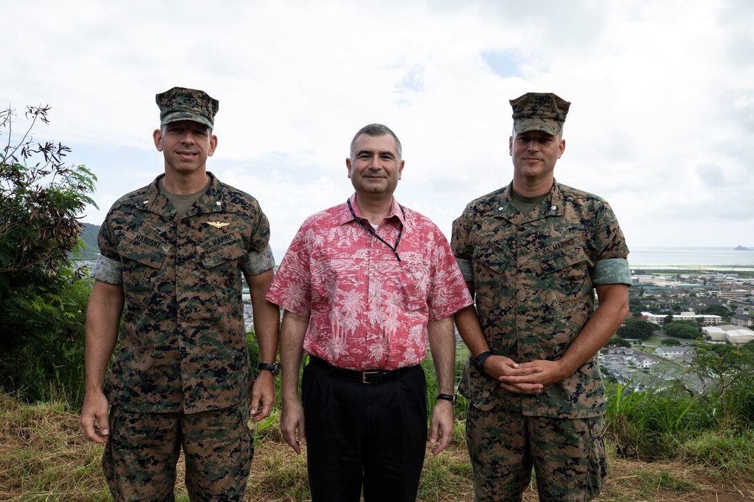 Karnig Ohannessian (Center), the Deputy Assistant Secretary of the Navy (Environmental), poses for a photo with U.S. Marine Corps Lt. Col. Frank Makoski, the director of S-3, and U.S. Marine Corps Lt. Col. Timothy Pochop, the director of Environmental Compliance and Protective Division, during a visit to MCBH, Oct. 24, 2018. Ohannessian attended a brief to discuss planning, protection, compliance, restoration, pollution prevention, and management of natural resources with cultural, operational and environmental leaders from the base. (U.S. Marine Corps photo by Sgt. Jesus Sepulveda Torres)