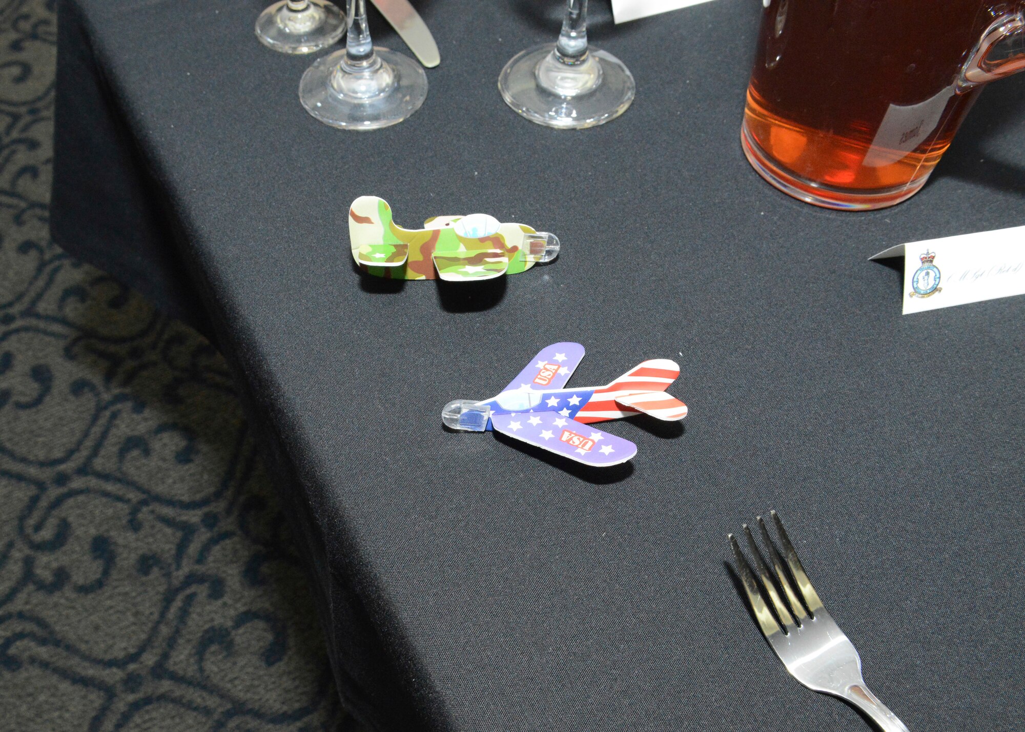 Little World War II-era airplanes were placed on each table at the Battle of Britain celebration held at Edwards AFB Nov. 9 at Club Muroc. (U.S. Air Force photo by Kenji Thuloweit)