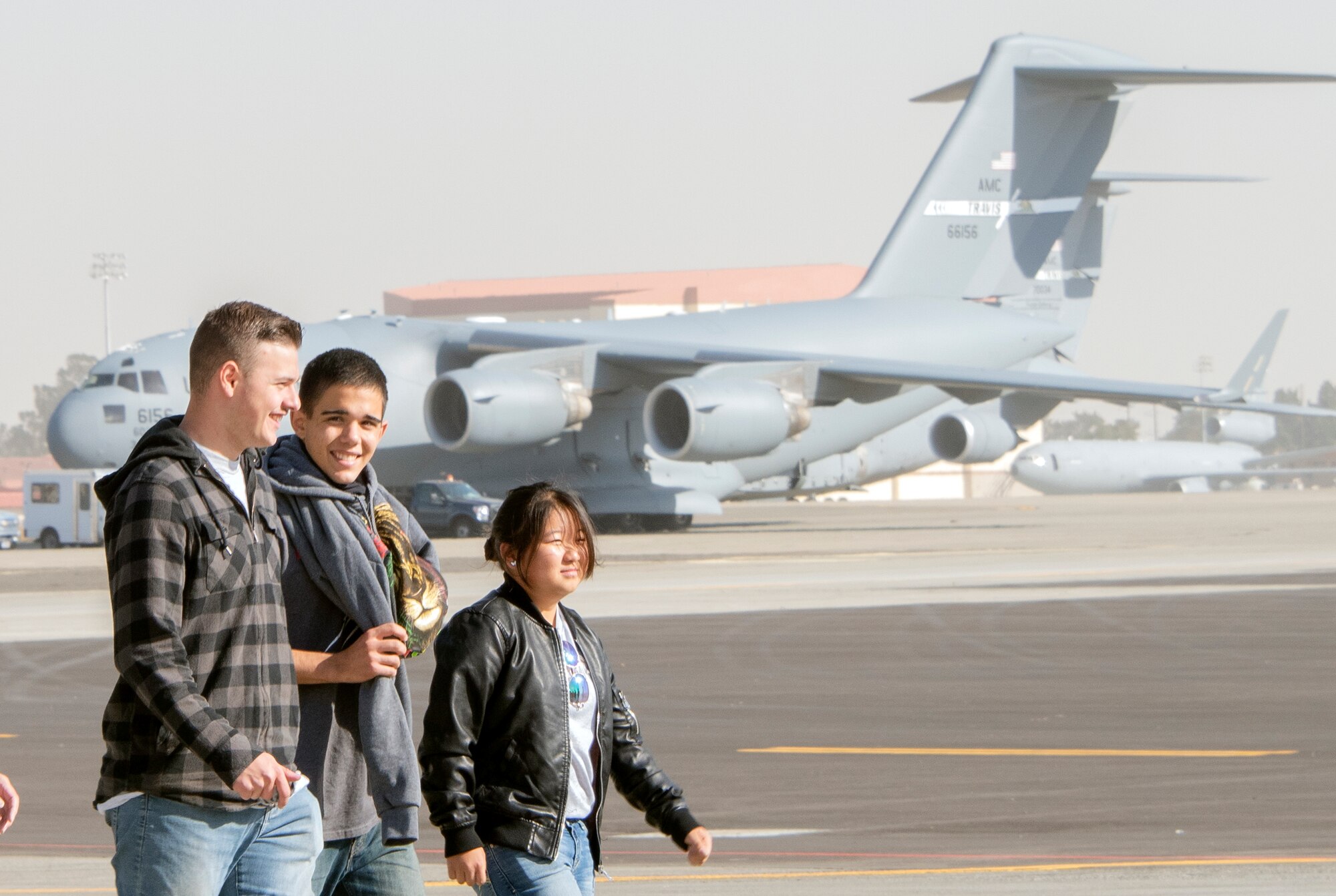 Students gain firsthand experience during a tour of static heavy lift aircraft during a base tour, Nov. 8, 2018, Travis Air Force Base, California. Travis hosted Junior Reserve Officer Training Corps students from three high schools in Northern Calif. Students learned about various career fields in the U.S. Air Force, toured static aircraft, a dormitory, and had the opportunity to talk with personnel about military life. (U.S. Air Force photo by Heide Couch)