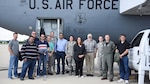 DCMA team stands in front of a KC-135 on the flight line.