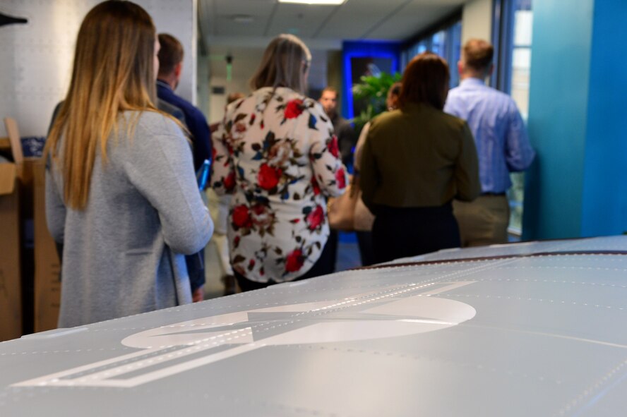 Airmen from the 432nd Wing/432nd Air Expeditionary Wing and the 799th Air Base Group receive a guided tour of the 30,000 square foot AFWERX-Las Vegas office space Nov. 5, 2018. Airmen visited to spark innovation and explore creative solutions to tactical-level problems. (U.S. Air Force Photo by Airman 1st Class Haley Stevens)